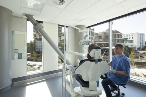 Doctor and patient in light filled treatment room in new Christchurch Hospital Outpatients Building