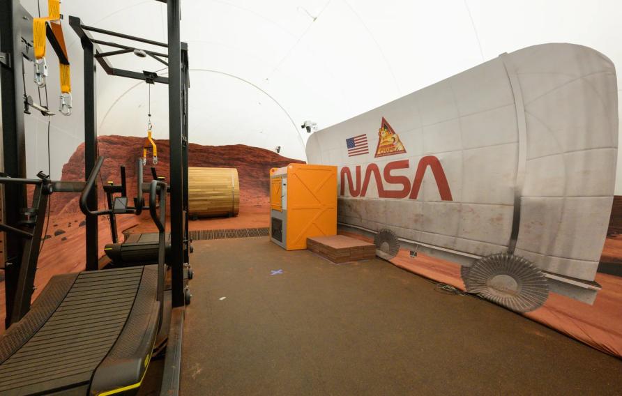 The sandbox portion of the Crew Health and Performance Exploration Analog habitat contains equipment such as a treadmill for use during virtual reality traverses. Bill Stafford/NASA