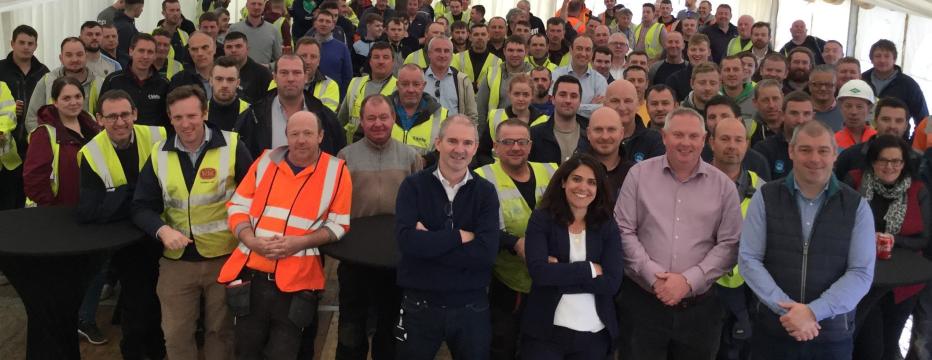 Diverse group of workers in safety vests