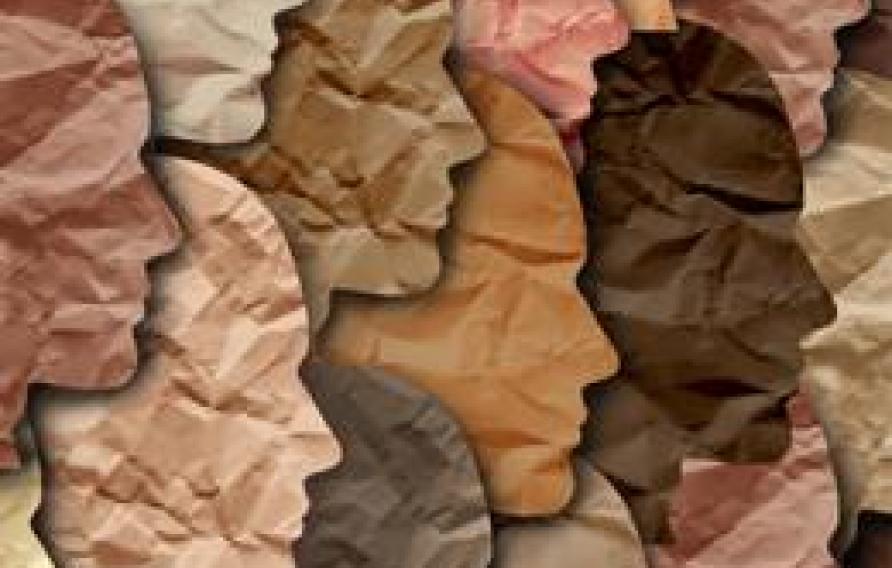 paper cutout of profiles of people in a diverse array of skin colors