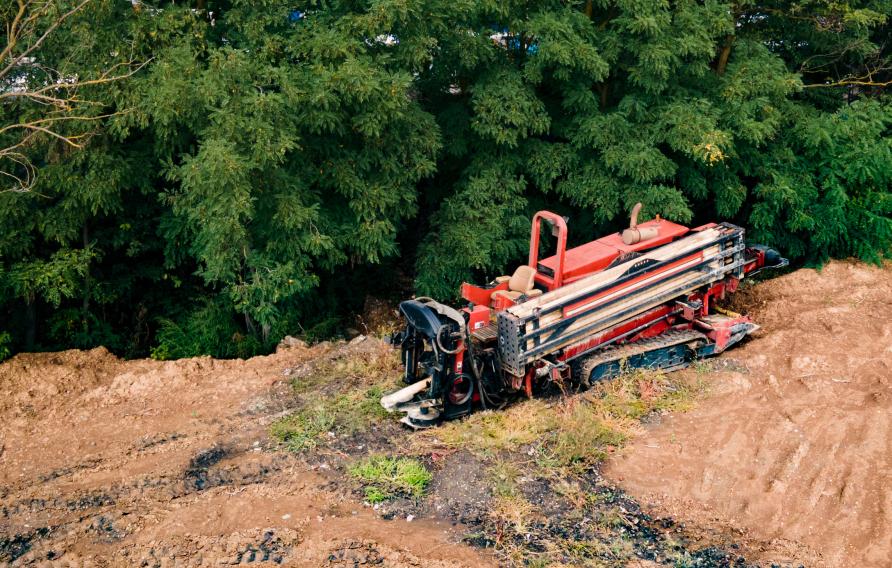 Trenchless machine in muddy field