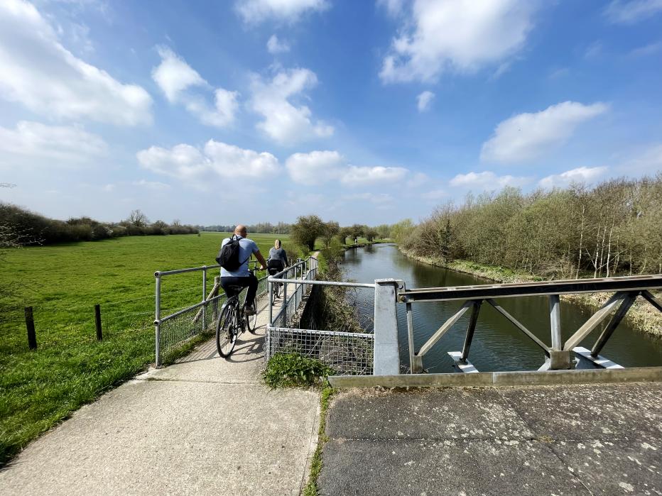 Two cyclist o a tow path along the River Stort in Hertfordshire. May 2023